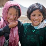 BAMYAN PROVINCE, Afghanistan - Two local girls enjoy the Arzu Studio Hope garden and playground in Dragon Valley, west of the town of Bamyan, June 20, 2012. Women enrolled the Arzu program receive higher-than average compensation for their work as rug weavers, and are required to attend literacy classes. They also have access to day care for their children, hot water to wash clothes, a kitchen, and a garden where they can grow their own vegetables and herbs. Younger children attend classes before and after weaving the rugs. (U.S. Army photo by Sgt. Ken Scar, 7th Mobile Public Affairs Detachment) - published in Bamyan Province emerges as a model for Afghanistan’s potential by rceast