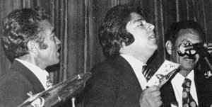 Ahmad Zahir flanked by Ustad F. M. Nangalai (left) and Ustad Ismail Azimi (right) at a concert in Kabul (late 1970s)